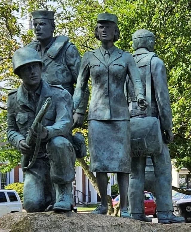 Bronze memorial statue honoring veterans of the armed forces